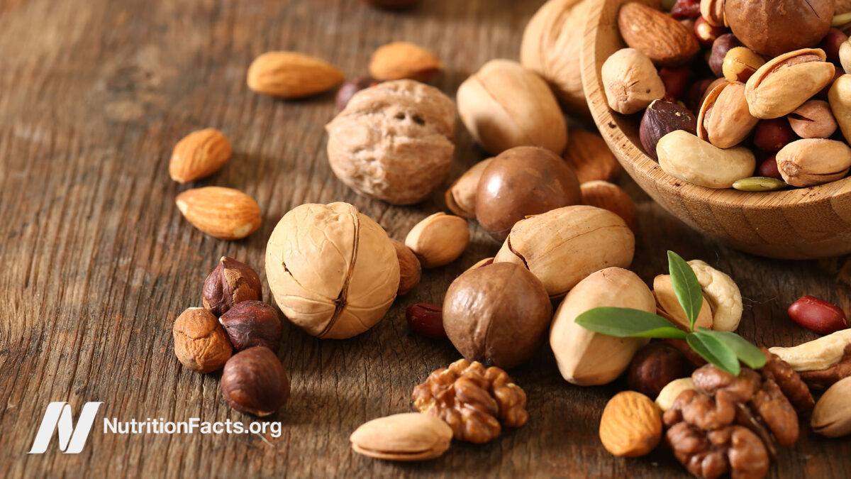 Assorted nuts on a wooden surface