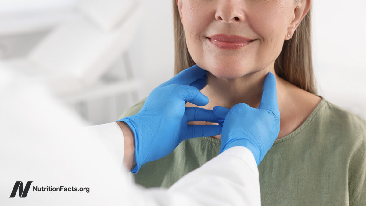 woman having a neck exam