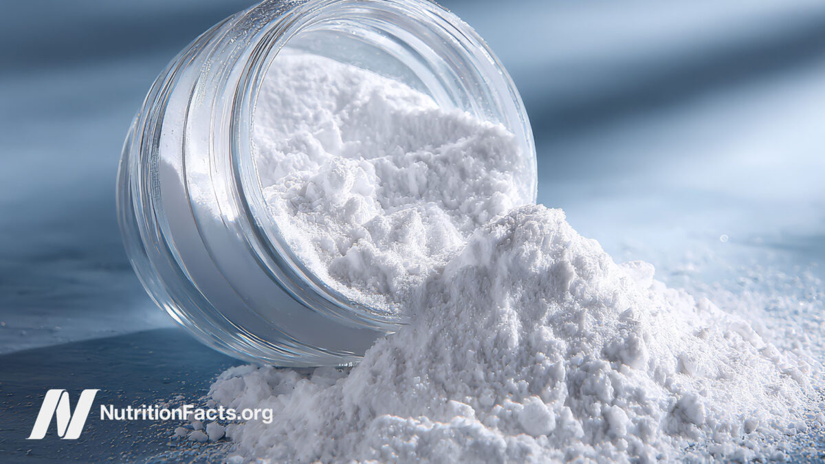 Powdered titanium dioxide spilling from a jar