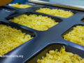 Trays of prepared Mac and cheese before baking